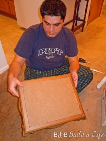 fitting the cork into the frame @ BandBBuildALife.com