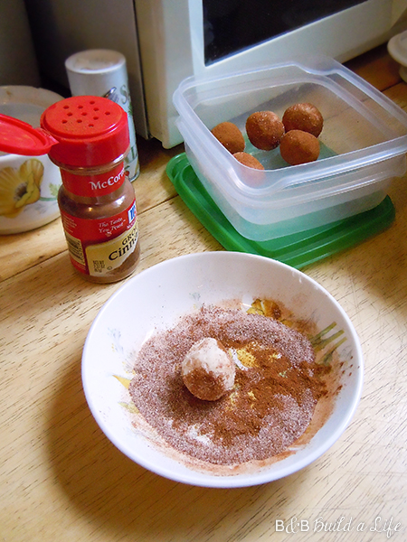  They're made of cream cheese, TONS of confectioner's sugar, and rolled into cinnamon to bitter them down a bit.  D-LISH.