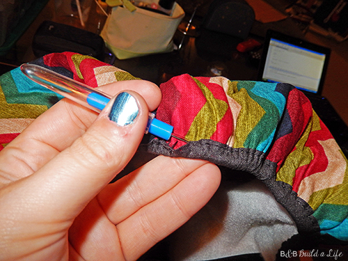 ironing board cover on clearance is turned into an awesome chevron pillow at BandBBuildALife.com