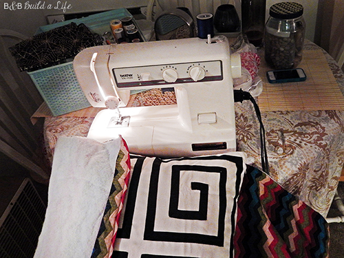 ironing board cover on clearance is turned into an awesome chevron pillow at BandBBuildALife.com