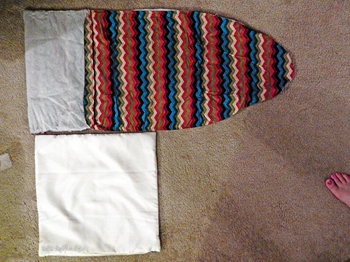 ironing board cover on clearance is turned into an awesome chevron pillow at BandBBuildALife.com