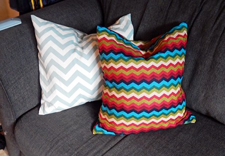 ironing board cover on clearance is turned into an awesome chevron pillow at BandBBuildALife.com