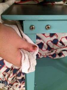 buffing wax onto chalk paint printer stand | from BandBBuildALife.com