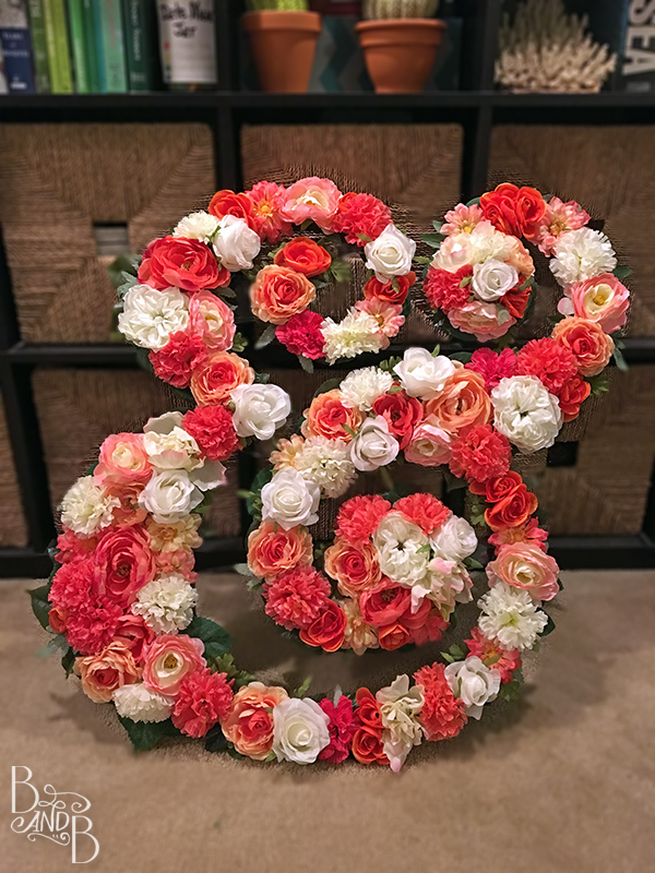 DIY Floating monogram initial letters to decorate pool at wedding