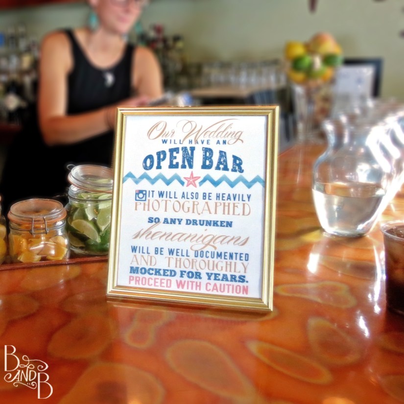 Hashtag wedding sign with selfie sticks and hashtag marquee outer banks wedding obx